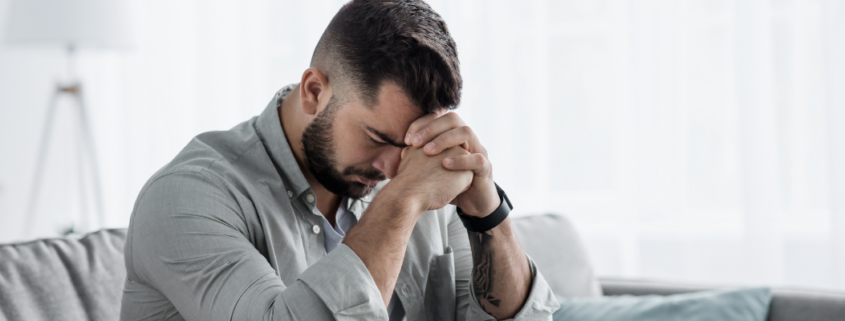 A professional and supportive banner for a Florida disability law firm. On the left, a soft-focus image of a person sitting by a window, reflecting the quiet struggle of mental health. On the right, clean text reads "Can I Get SSDI for Depression and Anxiety in Florida?" with a call to action for a free consultation at Quin Baker Law.